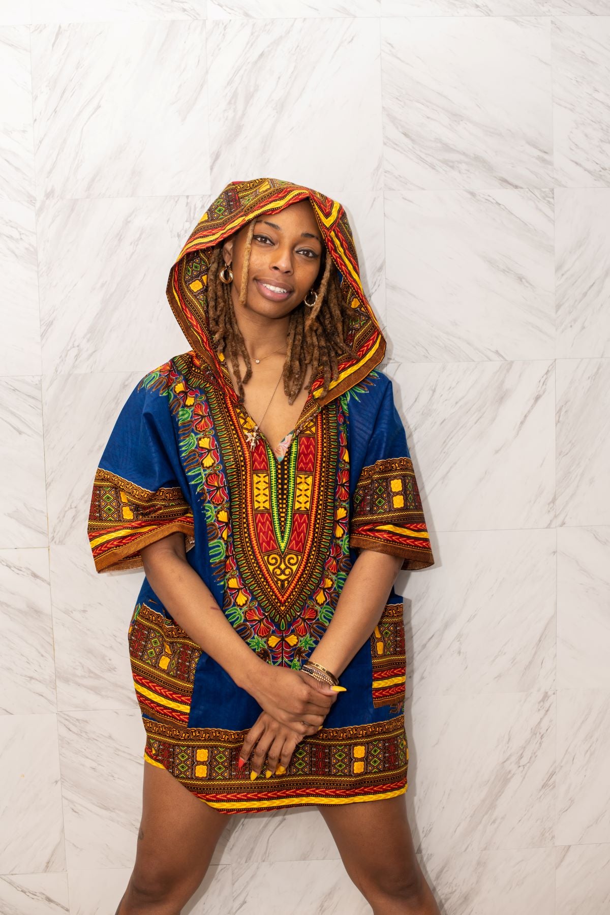 Model wearing a Simboo Nation dashiki hooded tunic